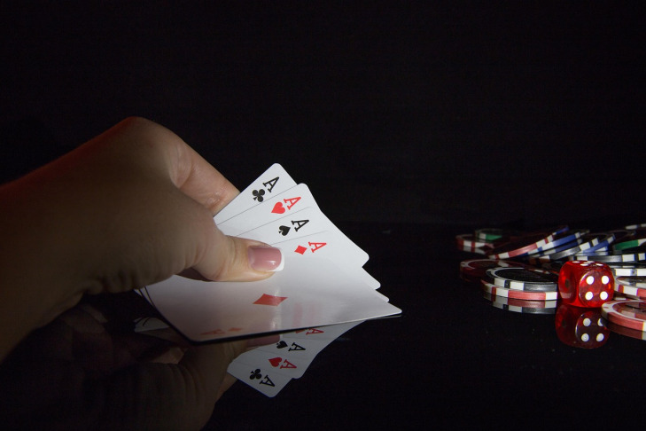 Colourful casino chips ready for a game of poker online at Ask Me Play