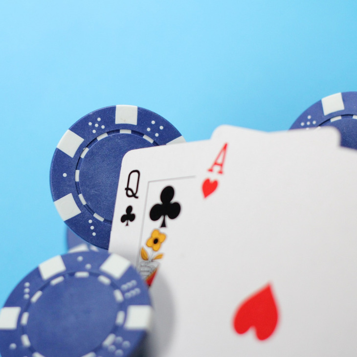 Live dealer blackjack table with casino chips and playing cards